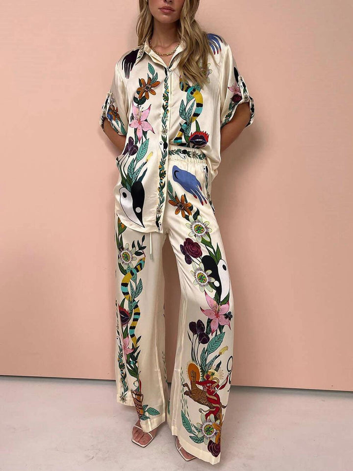 Olimpia | Completo camicia e pantaloni in satin con stampa unica, stile Resort
