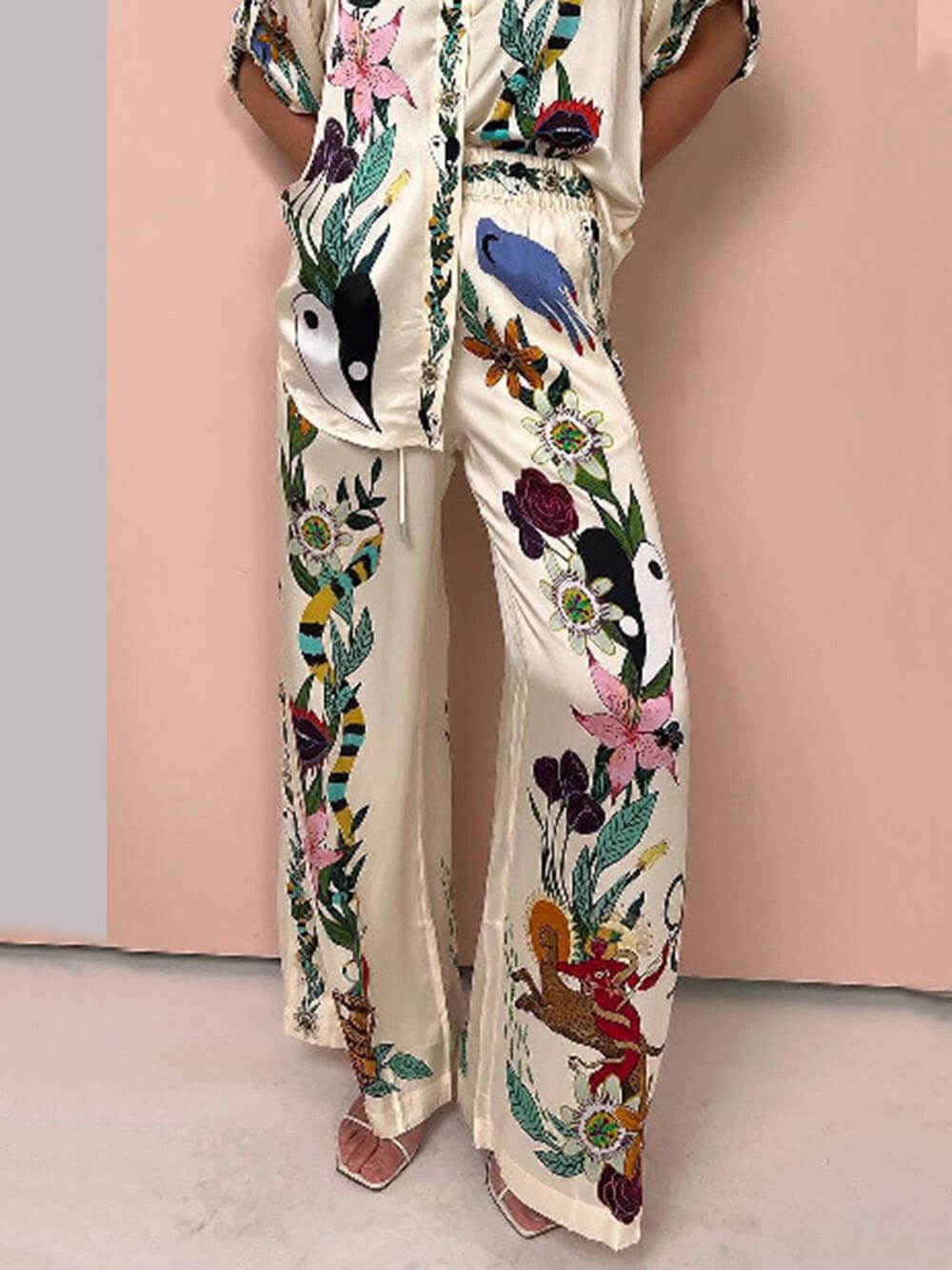 Olimpia | Completo camicia e pantaloni in satin con stampa unica, stile Resort
